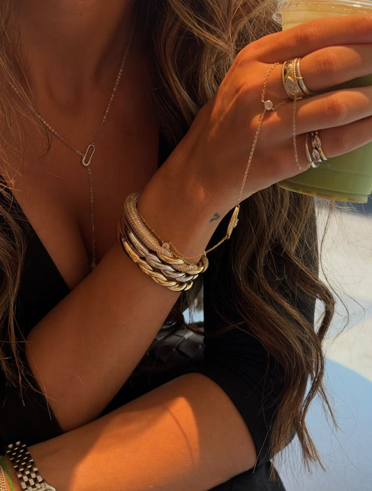 styled look with the interlinked ring, alix evil-eye hand chain, stefani pinky ring and ness ring — demi-fine jewelry by eti