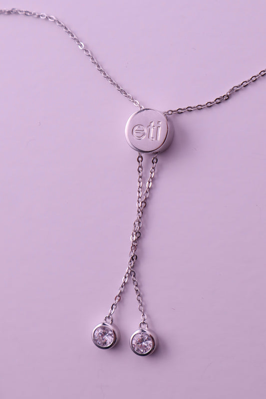 the victoria necklace — engraved disc charm necklace with blue heart stone