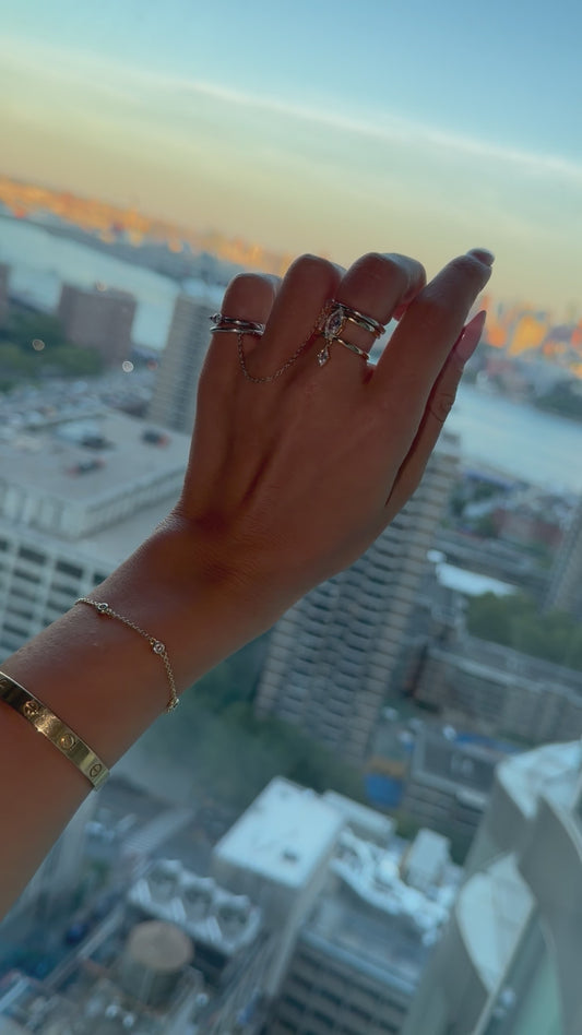 the leana ring — open-ended ring with dangling moissanite stones